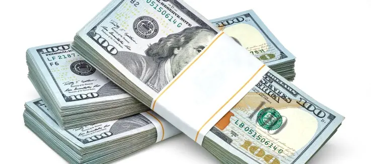 three packs of $100 bills